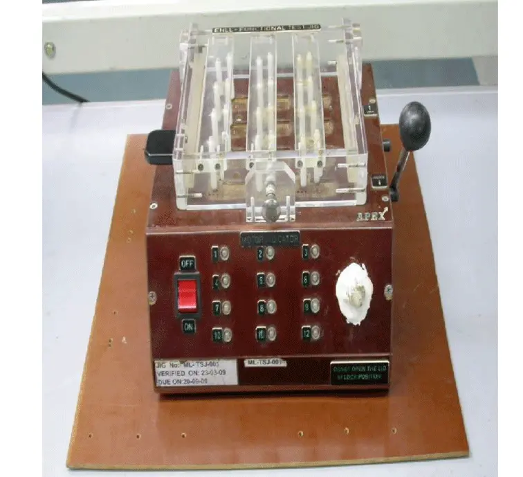 Electronic testing fixture with control switches and transparent relay housing used for hardware validation