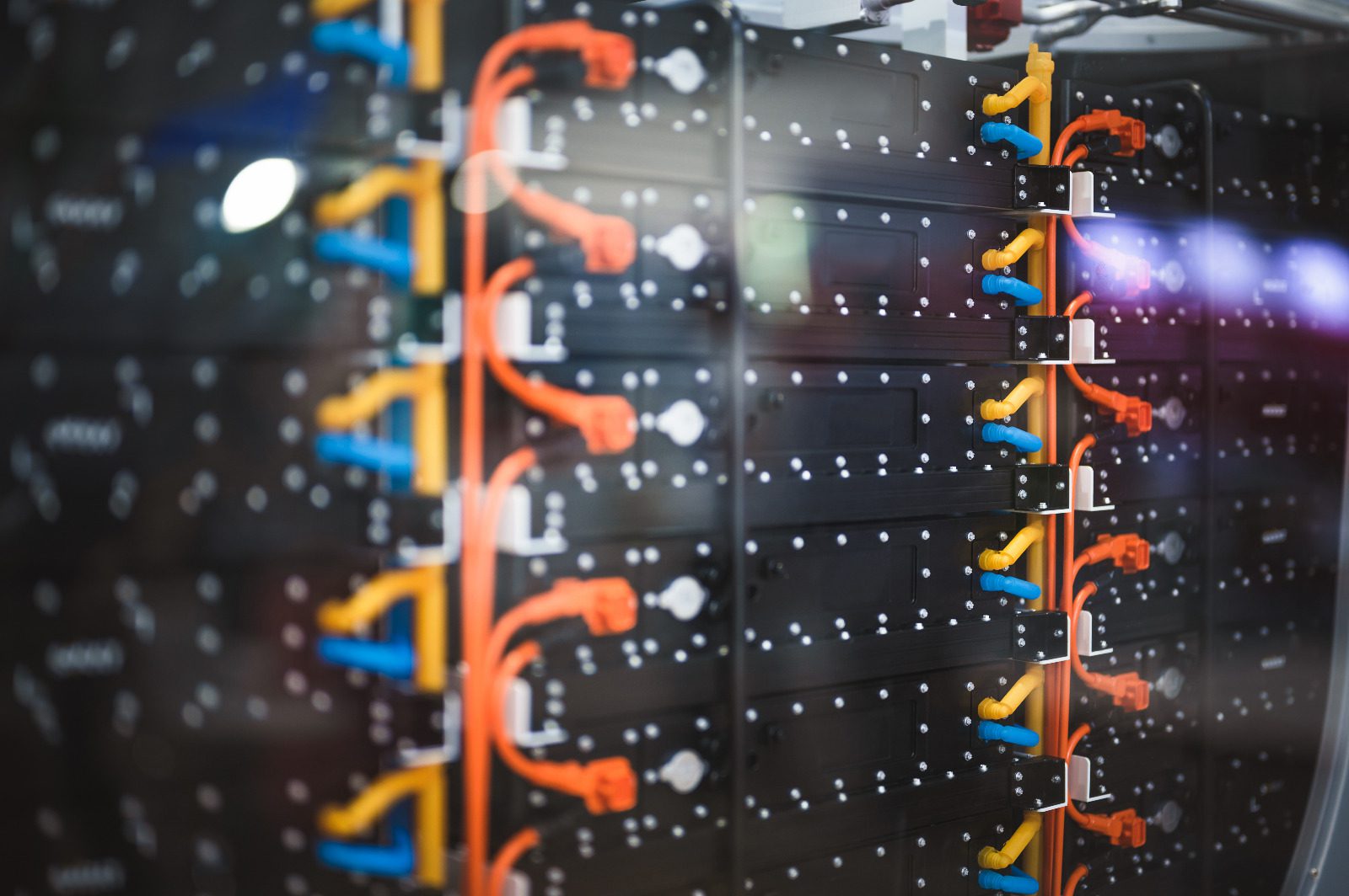 Rack-mounted battery energy storage system with modular battery packs and high-voltage power connections